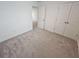 Spacious bedroom with neutral walls and carpet at 771 Gelderland Dr, Hampton, GA 30228