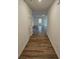 Bright entryway with wood-look flooring leading to the living room at 771 Gelderland Dr, Hampton, GA 30228