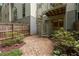 A backyard with gravel and stone walkways, along with a wooden fence and greenery at 1390 Stirling Nw Cir, Atlanta, GA 30318