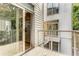 Outdoor deck with metal railing and stairs leading down. Sliding glass doors open to the kitchen at 1390 Stirling Nw Cir, Atlanta, GA 30318