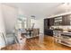 Open concept dining area with hardwood floors and a view of the kitchen at 1390 Stirling Nw Cir, Atlanta, GA 30318