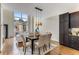 Bright dining room with hardwood floors and modern light fixture at 1390 Stirling Nw Cir, Atlanta, GA 30318