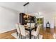 Modern dining area with glass table and hardwood floors at 1390 Stirling Nw Cir, Atlanta, GA 30318