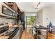 Modern kitchen with stainless steel appliances and access to backyard at 1390 Stirling Nw Cir, Atlanta, GA 30318