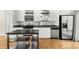 Close up view of the kitchen featuring stainless steel appliances, and white cabinetry at 1390 Stirling Nw Cir, Atlanta, GA 30318