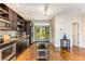 Modern kitchen with island, stainless steel appliances, and hardwood floors at 1390 Stirling Nw Cir, Atlanta, GA 30318