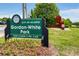 Sign for Gordon-White Park with flower beds and a modern metal sculpture on a grassy lawn at 1390 Stirling Nw Cir, Atlanta, GA 30318