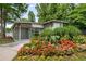 Pool house surrounded by lush flowers, greenery, and ample lighting at 1390 Stirling Nw Cir, Atlanta, GA 30318