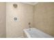 Shower featuring a tub and shower combination with tan tile at 1390 Stirling Nw Cir, Atlanta, GA 30318