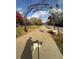 Entrance to the Woodall Rail Trail with an ornamental metal archway with bird designs at 1390 Stirling Nw Cir, Atlanta, GA 30318