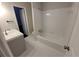 Bathroom with gray vanity, toilet and a white bathtub at 3123 Oak Dr, Marietta, GA 30066