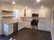 Renovated kitchen featuring white shaker cabinets and granite countertops at 3123 Oak Dr, Marietta, GA 30066