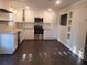 Modern white kitchen with granite countertops and stainless steel appliances at 3123 Oak Dr, Marietta, GA 30066