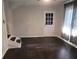 Living room with dark hardwood floors, neutral walls, and French doors at 3123 Oak Dr, Marietta, GA 30066