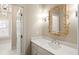 Stylish bathroom with quartz countertop and bamboo mirror at 3674 Kingsboro Ne Rd, Atlanta, GA 30319