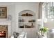 White built-in shelving with decorative accents and books at 3674 Kingsboro Ne Rd, Atlanta, GA 30319