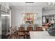 Farmhouse dining table with a unique light fixture at 3674 Kingsboro Ne Rd, Atlanta, GA 30319