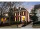 Brick home with a welcoming front porch and walkway at 3674 Kingsboro Ne Rd, Atlanta, GA 30319