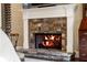 Stone fireplace in main bedroom adds warmth and charm at 3674 Kingsboro Ne Rd, Atlanta, GA 30319