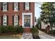 Elegant front entrance with dark blue double doors and brick accents at 3674 Kingsboro Ne Rd, Atlanta, GA 30319