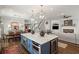 Open concept kitchen with island and wine fridge at 3674 Kingsboro Ne Rd, Atlanta, GA 30319