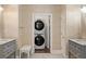 Convenient laundry room with stacked washer and dryer at 3674 Kingsboro Ne Rd, Atlanta, GA 30319