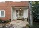 Inviting flagstone patio with a covered seating area and ceiling fan at 3674 Kingsboro Ne Rd, Atlanta, GA 30319