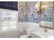 Stylish powder room with blue and white wallpaper at 3674 Kingsboro Ne Rd, Atlanta, GA 30319