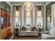 Cozy sitting room features a light grey sofa, green walls, and ample natural light at 3674 Kingsboro Ne Rd, Atlanta, GA 30319