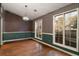 Dining room with hardwood floors and striped wallpaper at 415 Rockingham Ln, Woodstock, GA 30189