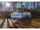 House exterior featuring a two-car garage and front yard at 415 Rockingham Ln, Woodstock, GA 30189