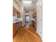 Kitchen with wooden cabinets and hardwood floors at 415 Rockingham Ln, Woodstock, GA 30189