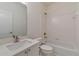 Clean bathroom with a shower/tub combo and white vanity at 5506 Sara Creek Ln, Sugar Hill, GA 30518