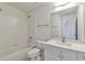 Clean bathroom with a bathtub, toilet and vanity at 5506 Sara Creek Ln, Sugar Hill, GA 30518