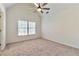 Bright bedroom with neutral walls and carpet at 5506 Sara Creek Ln, Sugar Hill, GA 30518