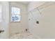 Laundry room with built-in shelving and marble flooring at 5506 Sara Creek Ln, Sugar Hill, GA 30518