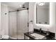 Elegant bathroom with frameless shower and dark vanity at 1598 W Sussex Ne Rd, Atlanta, GA 30306