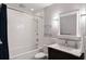 Clean bathroom with white subway tiles and a dark vanity at 1598 W Sussex Ne Rd, Atlanta, GA 30306