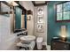 Stylish powder room with a marble sink and framed artwork at 1598 W Sussex Ne Rd, Atlanta, GA 30306