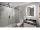 Contemporary bathroom with marble vanity and frameless shower at 1598 W Sussex Ne Rd, Atlanta, GA 30306