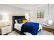 Stylish bedroom with a hanging chair and dark blue bedding at 1598 W Sussex Ne Rd, Atlanta, GA 30306