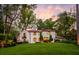 Evening view of two story home with manicured lawn at 1598 W Sussex Ne Rd, Atlanta, GA 30306