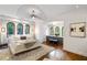 Elegant main bedroom featuring a comfortable bed, ample natural light, and a built-in dresser at 1598 W Sussex Ne Rd, Atlanta, GA 30306