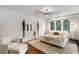 Bright and airy main bedroom with a king bed and en-suite bathroom at 1598 W Sussex Ne Rd, Atlanta, GA 30306