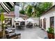 Charming patio with fireplace, string lights, and seating areas at 1598 W Sussex Ne Rd, Atlanta, GA 30306