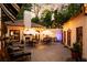 Outdoor patio with fireplace and string lights at night at 1598 W Sussex Ne Rd, Atlanta, GA 30306