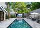 Stunning pool with a large patio and tropical landscaping at 1598 W Sussex Ne Rd, Atlanta, GA 30306