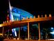 Entrance of the Georgia Aquarium at night, featuring illuminated signage, architecture, and landscaping at 1598 W Sussex Rd, Atlanta, GA 30306