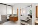 Bright bathroom featuring wood vanity and doorway to the main bedroom at 1598 W Sussex Rd, Atlanta, GA 30306