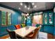 Elegant dining room with colorful chairs, custom cabinetry, and modern chandelier at 1598 W Sussex Rd, Atlanta, GA 30306